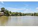 Picturesque lake view showcasing waterfront homes nestled among mature trees at 81002 Alexander, Chapel Hill, NC 27517