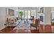 Bright living room boasts ample natural light, a decorative fireplace, stylish furniture, and pristine hardwood floors at 81002 Alexander, Chapel Hill, NC 27517
