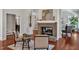 A cozy fireplace enhances the inviting atmosphere of this living room with beautiful hardwood floors at 81002 Alexander, Chapel Hill, NC 27517
