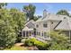 Charming back exterior featuring a screened porch and deck, ideal for outdoor living and entertaining at 81002 Alexander, Chapel Hill, NC 27517