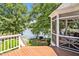 Inviting screened porch offers serene lake views and access to an outdoor deck at 81002 Alexander, Chapel Hill, NC 27517