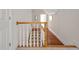 Staircase with wood banister and white spindles leading to the upper level at 81002 Alexander, Chapel Hill, NC 27517
