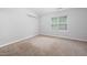 This is a bedroom featuring a neutral color palette and a window allowing natural light at 8422 Central Dr, Raleigh, NC 27613