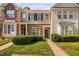 Charming townhome with stone accents, a well-manicured lawn, and a welcoming front entryway at 8422 Central Dr, Raleigh, NC 27613