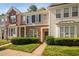 Charming townhome with stone accents, a well-manicured lawn, and a welcoming front entryway at 8422 Central Dr, Raleigh, NC 27613