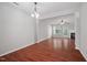 Spacious living area with hardwood floors, fireplace, and an open layout to the kitchen at 8422 Central Dr, Raleigh, NC 27613