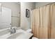 Clean bathroom with a well-maintained sink, and updated fixtures, plus a framed mirror and neutral color palette at 8885 Commons Townes Dr, Raleigh, NC 27616