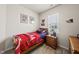 Comfortable bedroom with a cozy bed, bright natural light, and carpeted floor, great for or guests at 8885 Commons Townes Dr, Raleigh, NC 27616