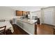 Eat-in kitchen features granite countertops and stainless steel appliances at 8885 Commons Townes Dr, Raleigh, NC 27616