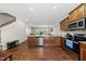 Open-concept kitchen with stainless steel appliances and seamless flow into adjacent living spaces at 8885 Commons Townes Dr, Raleigh, NC 27616