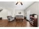 Inviting living room showcasing a comfortable sofa, armchair, and natural light from the glass panel door at 8885 Commons Townes Dr, Raleigh, NC 27616