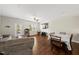 Open-concept living area featuring hardwood floors and plenty of space at 8885 Commons Townes Dr, Raleigh, NC 27616