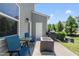 Private backyard patio with outdoor seating, barbecue grill, and well-maintained landscaping perfect for summer at 8885 Commons Townes Dr, Raleigh, NC 27616