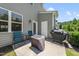 Outdoor patio with seating and a grill at 8885 Commons Townes Dr, Raleigh, NC 27616