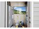 Organized storage space featuring a water heater, wall-mounted TV, and shelves for efficient use of space at 8885 Commons Townes Dr, Raleigh, NC 27616
