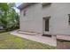 Exterior view of the home's backyard, featuring a brick exterior and a door leading to the yard at 914 Cindy St, Cary, NC 27511