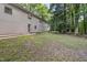 Exterior of home and landscaped yard with a brick exterior and a walkway to the backyard at 914 Cindy St, Cary, NC 27511