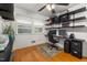 Well-lit room featuring hardwood floors and a desk area with shelving at 914 Cindy St, Cary, NC 27511