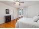 Inviting bedroom with hardwood floors and a view of the adjoining bathroom at 914 Cindy St, Cary, NC 27511