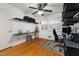 Spacious room featuring hardwood floors and a desk area with shelving at 914 Cindy St, Cary, NC 27511