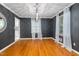 Elegant dining room with dark grey walls, hardwood floors and modern lighting at 914 Cindy St, Cary, NC 27511