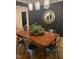 Stylish dining room with wood table and seating illuminated by pendant lighting at 914 Cindy St, Cary, NC 27511