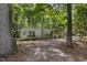 Quaint front exterior with mature trees, gravel drive and decorative accents at 914 Cindy St, Cary, NC 27511