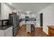 Well-lit kitchen with stainless steel appliances, an island with seating and plenty of storage at 914 Cindy St, Cary, NC 27511