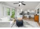 Bright living room features stylish decor, hardwood floors and a peek into the kitchen area at 914 Cindy St, Cary, NC 27511
