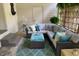 Inviting porch with cushioned seating, patterned rug, and a tranquil ambiance at 914 Cindy St, Cary, NC 27511