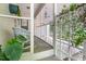 Inviting porch with wicker chair and colorful rug, enhanced by greenery at 914 Cindy St, Cary, NC 27511