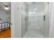 Modern bathroom featuring stylish glass enclosed shower, neutral tile, and mosaic accents at 914 Cindy St, Cary, NC 27511