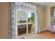 Backyard view from the Kitchen with a fence, grill, grass and landscaping at 997 Windy Rd, Apex, NC 27502