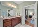 Bathroom with double vanity and view of the main bedroom at 997 Windy Rd, Apex, NC 27502