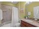 Bathroom with vanity, a large mirror, shower-tub combination with tile at 997 Windy Rd, Apex, NC 27502