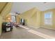 Bonus room with seating area, television, and natural light at 997 Windy Rd, Apex, NC 27502