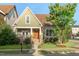 Inviting craftsman-style home with a well-manicured lawn and charming front porch at 997 Windy Rd, Apex, NC 27502
