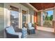 Inviting front porch area with comfortable chairs and a relaxing outdoor ambiance at 997 Windy Rd, Apex, NC 27502