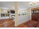 Spacious living room with hardwood floors, fireplace, and custom built-in shelving at 997 Windy Rd, Apex, NC 27502