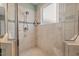 Bright tiled shower with glass door at 997 Windy Rd, Apex, NC 27502