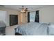 Bedroom features a ceiling fan, carpeted floor, and window with black out curtains at 101 Kingston Ln, Graham, NC 27253