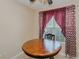 Cozy breakfast nook featuring a round table, chair, and natural light from the window at 101 Kingston Ln, Graham, NC 27253
