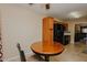 Eat-in kitchen with black appliances, and wood cabinets, next to the living room at 101 Kingston Ln, Graham, NC 27253