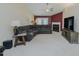 Living room area featuring a fireplace, vaulted ceilings, and carpeting at 101 Kingston Ln, Graham, NC 27253