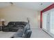Large living room with French doors to the rear, ceiling fan, and fireplace at 101 Kingston Ln, Graham, NC 27253
