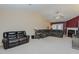Spacious living room featuring a high ceiling, a ceiling fan, and large sofas at 101 Kingston Ln, Graham, NC 27253