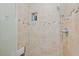 Close-up of tiled shower with shower head and built-in shelving at 101 Kingston Ln, Graham, NC 27253