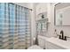 Stylish bathroom with a shower/tub combo, updated vanity, and modern fixtures at 1022 Carolina Ave, Durham, NC 27705