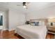 Inviting bedroom with hardwood floors, a ceiling fan, soft lighting, and neutral tones at 1022 Carolina Ave, Durham, NC 27705