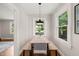 Bright dining area with natural light, modern light fixture and a table for seating at 1022 Carolina Ave, Durham, NC 27705